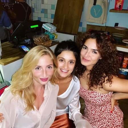 Therica Wilson-Read with her co-stars Anya Chalotra and Anna Shaffer